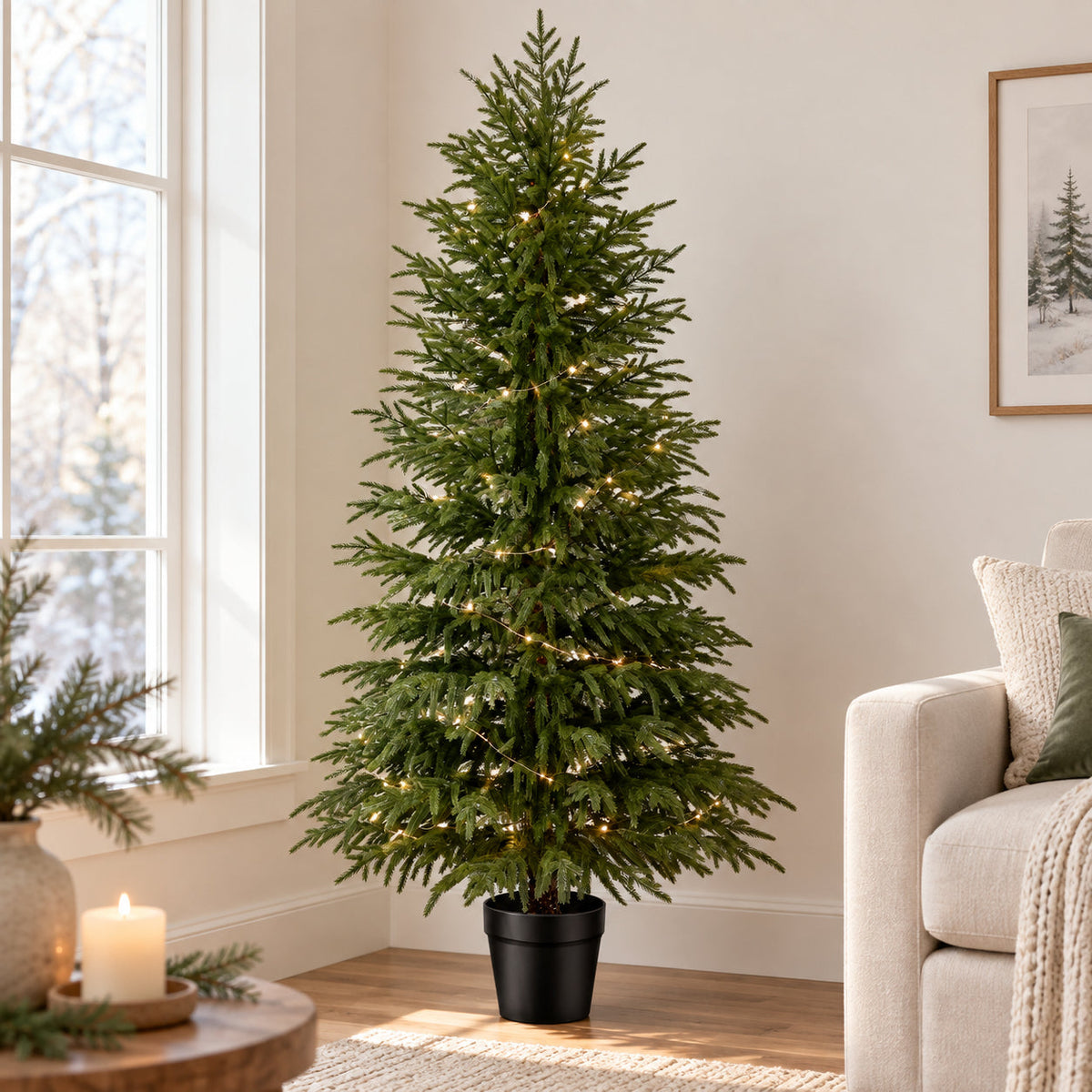 Minimal artificial Christmas tree with warm lights in a bright neutral living room